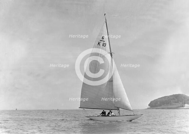 The 6 Metre yacht 'Polly' (K10) sailing upwind, 1921. Creator: Kirk & Sons of Cowes.