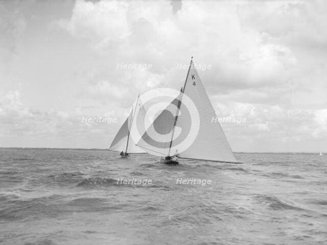 The 7 Metre class 'Anitra' (K4) and 'Ginevra' (K7) race downwind, 1912. Creator: Kirk & Sons of Cowes.