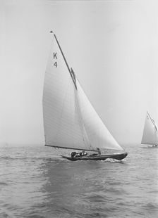 The 7 Metre Anitra (K4) sailing close-hauled, 1912. Creator: Kirk & Sons of Cowes