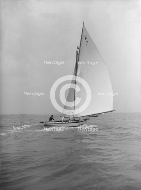 The 7 Metre 'Ginerva' (K7) under sail, 1912. Creator: Kirk & Sons of Cowes.