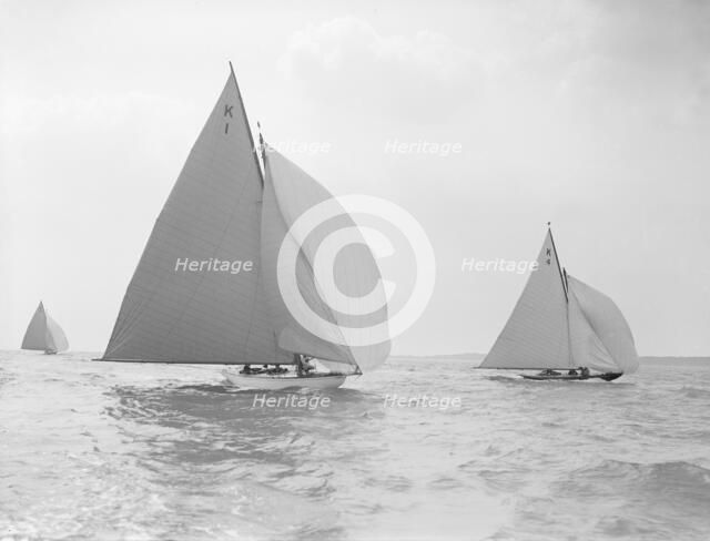 The 7 Metre 'Marsinah' (K1) and 'Anitra' (k4) racing downwind, 1912. Creator: Kirk & Sons of Cowes.
