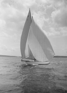 The 7 Metre Marsinah (K1) sailing with spinnaker, 1912. Creator: Kirk & Sons of Cowes