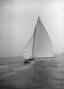 The 7 Metre Marsinah (K1) sailing with spinnaker, 1912. Creator: Kirk & Sons of Cowes