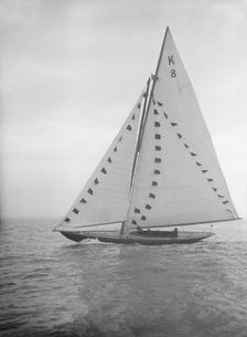 The 7 Metre sailing yacht Pinaster (K8) with prize flags, 1912. Creator: Kirk & Sons of Cowes