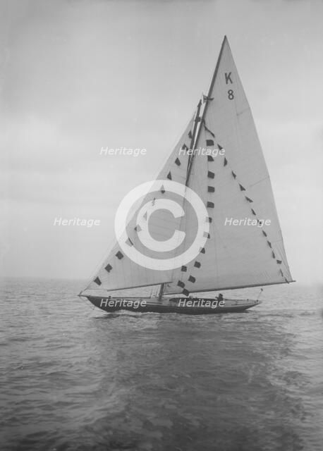 The 7 Metre sailing yacht 'Pinaster' (K8) with prize flags, 1912. Creator: Kirk & Sons of Cowes.