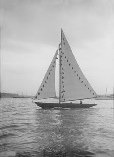 The 7 Metre sailing yacht Pinaster (K8) with prize flags, 1912. Creator: Kirk & Sons of Cowes