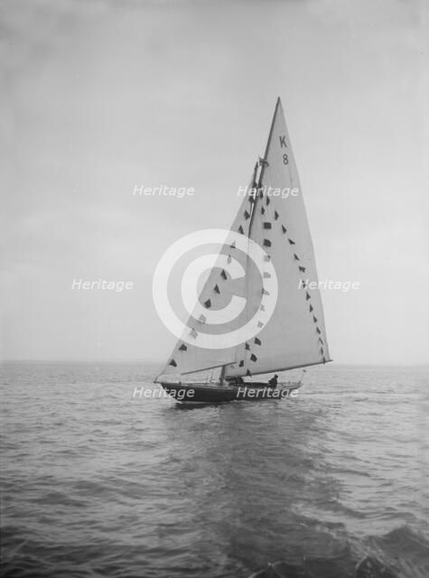 The 7 Metre sailing yacht 'Pinaster' (K8) with prize flags, 1912. Creator: Kirk & Sons of Cowes.