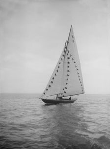 The 7 Metre sailing yacht Pinaster (K8) with prize flags, 1912. Creator: Kirk & Sons of Cowes