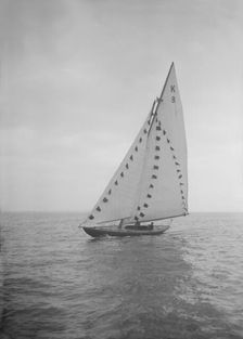 The 7 Metre sailing yacht Pinaster (K8) with prize flags, 1912. Creator: Kirk & Sons of Cowes