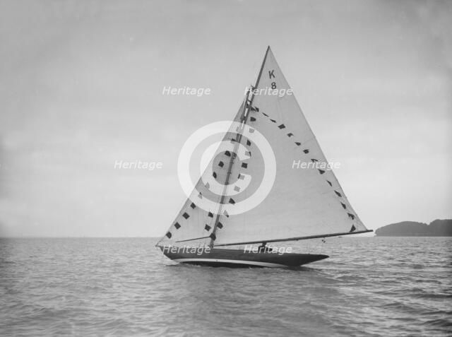 The 7 Metre sailing yacht 'Pinaster' (K8) with prize flags, 1912. Creator: Kirk & Sons of Cowes.