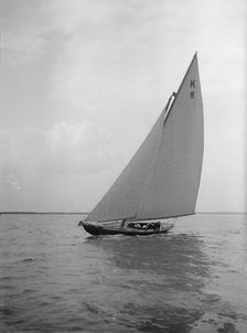 The 7 Metre yacht Pinaster (K8) sailing with spinnaker, 1912. Creator: Kirk & Sons of Cowes