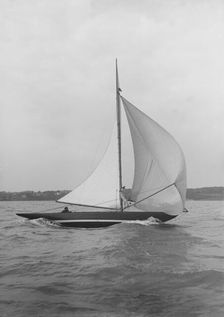 The 7 Metre yacht Pinaster (K8) sailing with spinnaker, 1913. Creator: Kirk & Sons of Cowes
