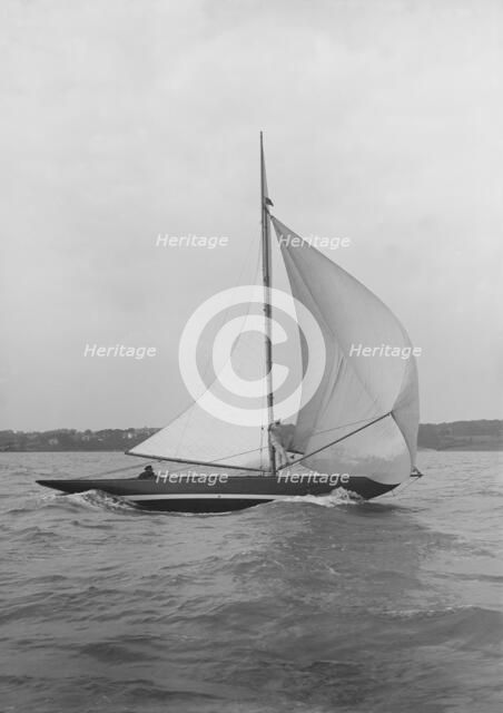 The 7 Metre yacht 'Pinaster' (K8) sailing with spinnaker, 1913. Creator: Kirk & Sons of Cowes.