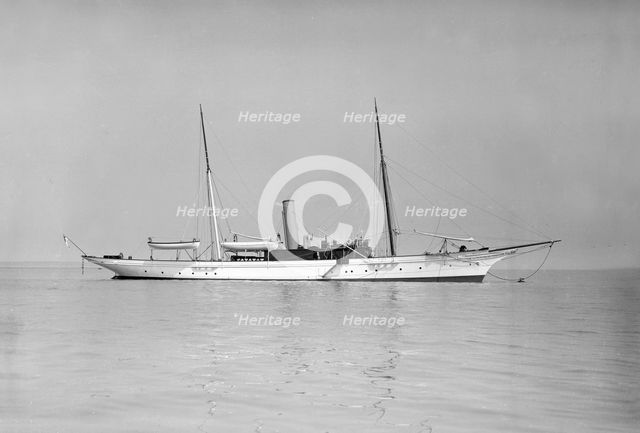 The 70 ton steam yacht 'Ombra' at anchor, 1911. Creator: Kirk & Sons of Cowes.