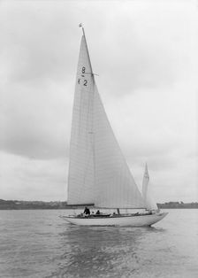 The 8 Metre Carron (K2) sailing upwind, 1934. Creator: Kirk & Sons of Cowes