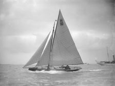 The 8 Metre class Kathleen (H10) sailing upwind in a good breeze, 1911. Creator: Kirk & Sons of Cowes