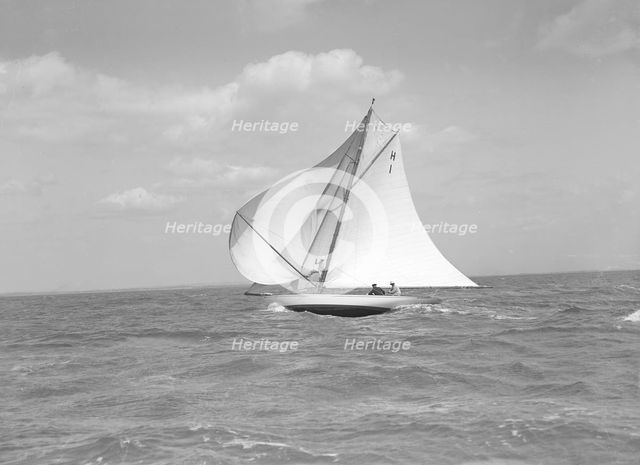 The 8 Metre class 'Norman' (H1) running  downwind in a good breeze, 1911. Creator: Kirk & Sons of Cowes.