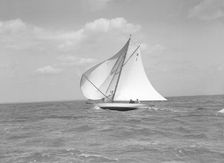The 8 Metre class Norman (H1) running downwind in a good breeze, 1911. Creator: Kirk & Sons of Cowes