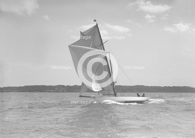 The 8 Metre class 'Norman' running in a good breeze, 1911. Creator: Kirk & Sons of Cowes.