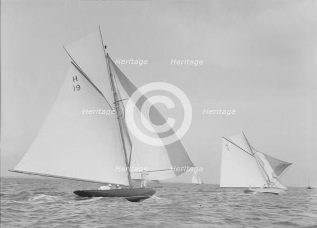 The 8 Metre 'Antwerpia' (H19) and 'Windflower' (H3) racing under spinnaker, 1911. Creator: Kirk & Sons of Cowes.