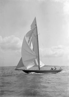 The 8 Metre Endrick sailing downwind under spinnaker, 1911. Creator: Kirk & Sons of Cowes