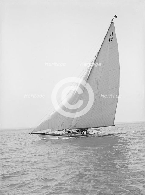 The 8 Metre 'Ierne' (H17) sailing close-hauled, 1914. Creator: Kirk & Sons of Cowes.