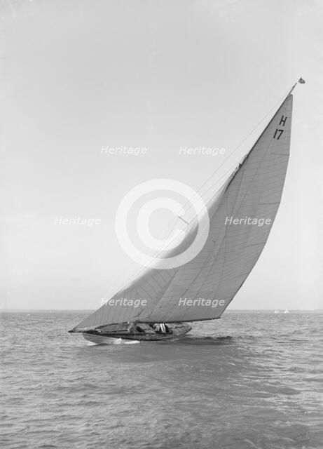 The 8 Metre 'Ierne' (H17) sailing close-hauled, 1914. Creator: Kirk & Sons of Cowes.