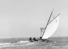 The 8 Metre sailing yacht Dilkusha setting spinnaker, 1911. Creator: Kirk & Sons of Cowes