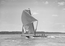 The 8 Metre sailing yacht Endrick sailing downwind under spinnaker, 1911. Creator: Kirk & Sons of Cowes