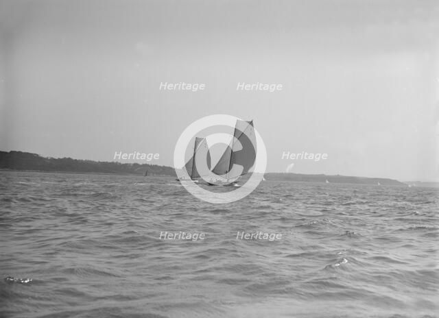 The 8 Metre sailing yachts 'Endrick' and 'Spero' racing downwind, 1911. Creator: Kirk & Sons of Cowes.