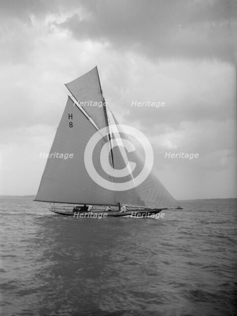 The 8 Metre 'Spero' (H8) sailing upwind, 1912. Creator: Kirk & Sons of Cowes.