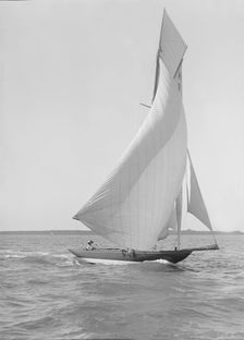 The 8 Metre Termagent (H9) sailing downwind in fine weather, 1911. Creator: Kirk & Sons of Cowes
