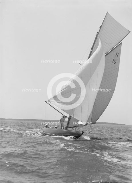 The 8 Metre yacht 'Antwerpia' (H19) sailing with spinnaker, 1911. Creator: Kirk & Sons of Cowes.