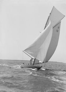 The 8 Metre yacht Antwerpia (H19) sailing with spinnaker, 1911. Creator: Kirk & Sons of Cowes