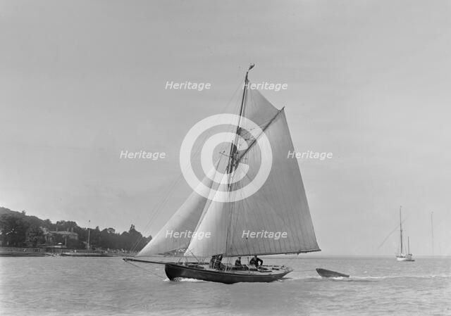 The 9 ton auxilary cutter 'Grayling', 1921. Creator: Kirk & Sons of Cowes.
