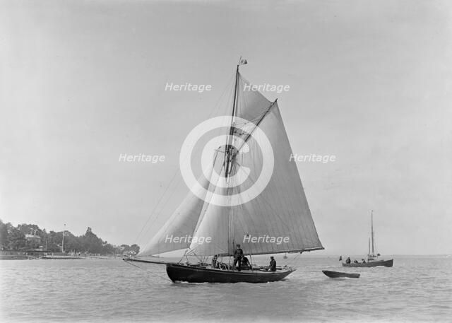 The 9 ton auxilary cutter 'Grayling', 1921. Creator: Kirk & Sons of Cowes.