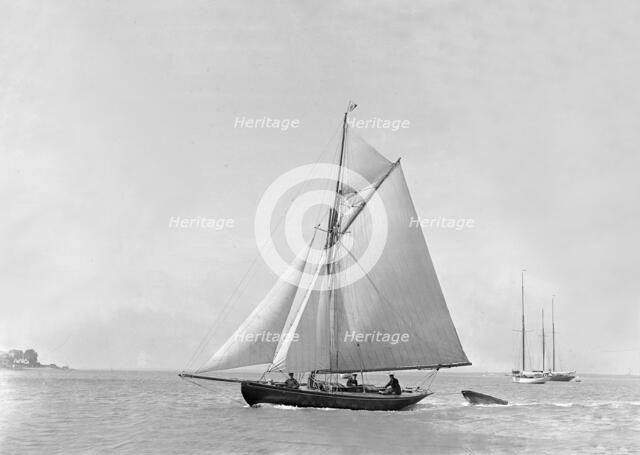 The 9 ton auxilary cutter 'Grayling', 1921. Creator: Kirk & Sons of Cowes.