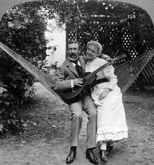 The Musical Pair in the Hammock Artist: American Stereoscopic Company