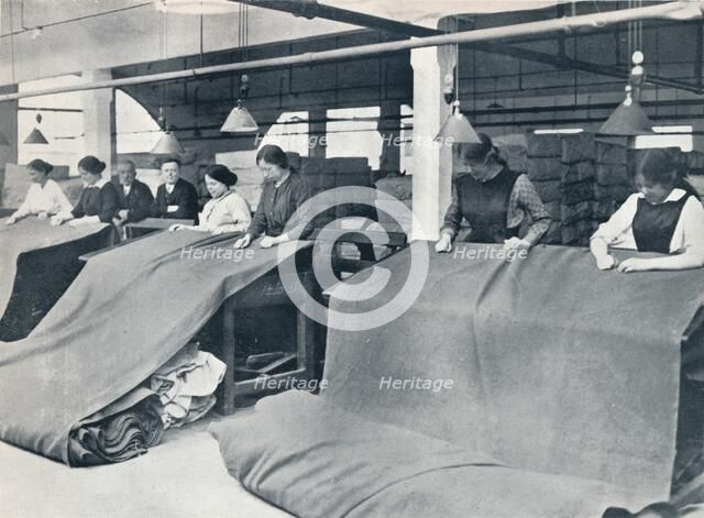 The Making of khaki: examining the finished cloth, c1914.
