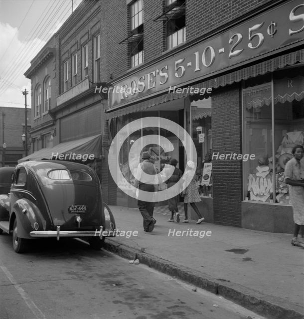The main street, Fayetteville Street, of Siler City, North Carolina, 1939. Creator: Dorothea Lange.