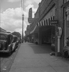 The main street, Fayetteville Street, of Siler City, North Carolina, 1939. Creator: Dorothea Lange