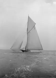 The majestic 15 Metre class Pamela sailing with spinnaker, 1913. Creator: Kirk & Sons of Cowes
