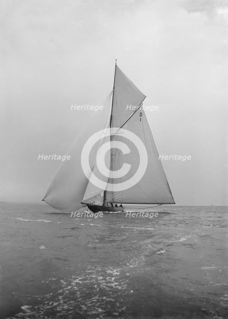 The majestic 15 Metre class 'Pamela' sailing with spinnaker, 1913. Creator: Kirk & Sons of Cowes.