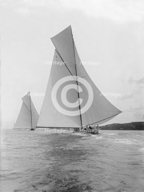 The majestic cutters 'White Heather' and 'Shamrock' race downwind, 1912. Creator: Kirk & Sons of Cowes.