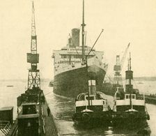 The "Majestic" Entering Dry Dock Hauled by Tugs c1930. Creator: Unknown