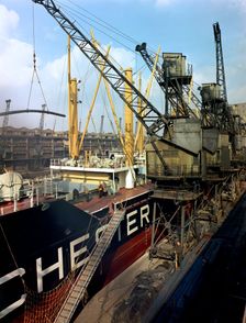 The Manchester Renown being loaded with steel for export, Manchester, 1964. Creator: Michael Walters