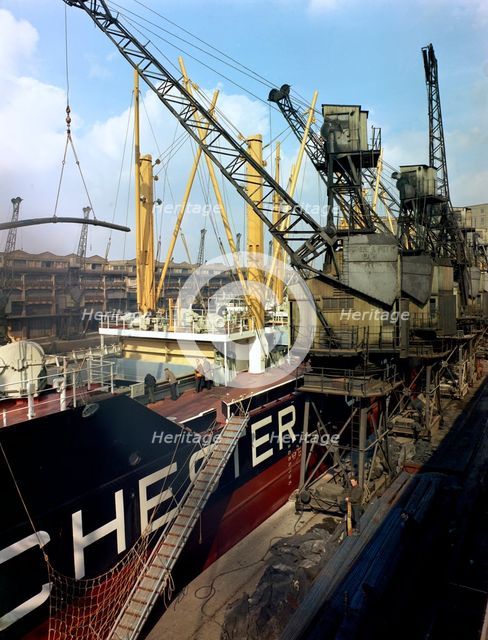 The 'Manchester Renown' being loaded with steel for export, Manchester, 1964.  Creator: Michael Walters.