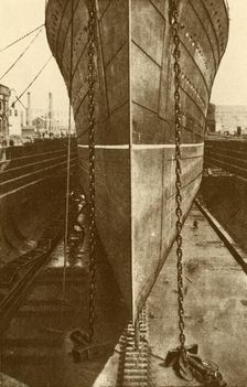 The "Mauretania" in Dry Dock c1930. Creator: H. Aslin