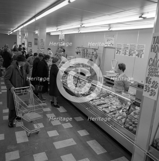 The meat counter at the ASDA supermarket in Rotherham, South Yorkshire, 1969.  Creator: Michael Walters.