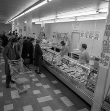 The meat counter at the ASDA supermarket in Rotherham, South Yorkshire, 1969. Creator: Michael Walters